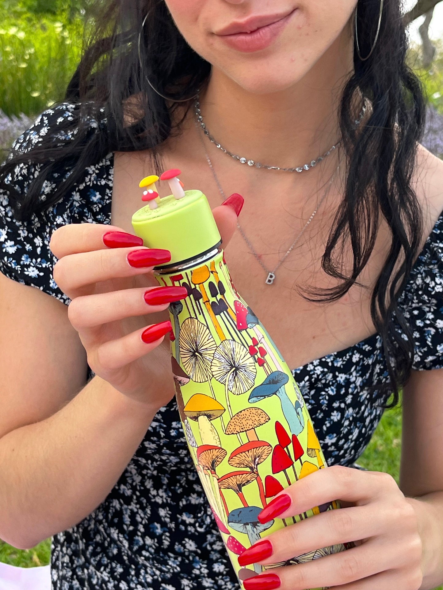 girl holding mushroom bottle